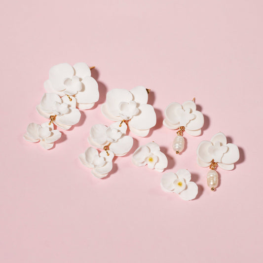 Pendientes Colección floral hechos a mano de arcilla polimérica y acero inoxidable con forma de orquídeas.